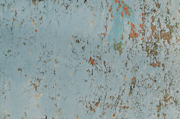 Rusty metal. Old peeling paint. Cracks.