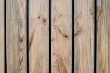 Wooden fence. Tree structure. Board. The wall is made of wood.
