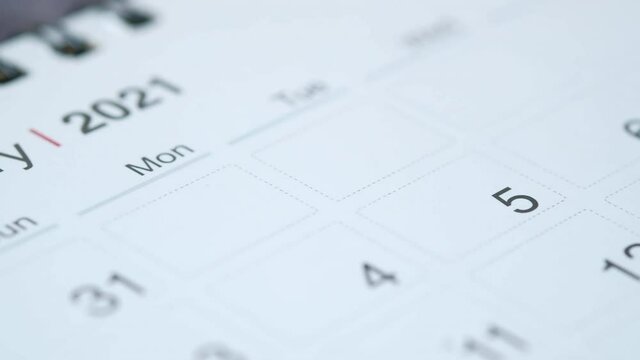 white color 2021 calendar on wooden background 