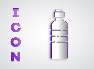 Paper cut Bottle of water icon isolated on grey background. Soda aqua drink sign. Paper art style. Vector Illustration.