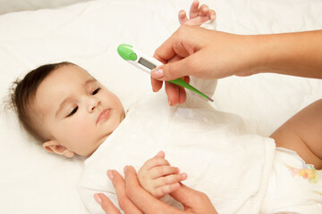 Little cute baby girl on the blanket