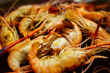 The grilled shrimp on the stove are about to be ready to eat.