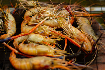 The grilled shrimp on the stove are about to be ready to eat.