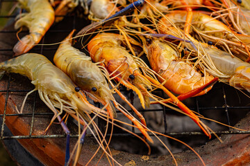 The grilled shrimp on the stove are about to be ready to eat.