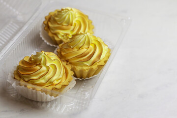 Tasty lemon tart with meringue on light background