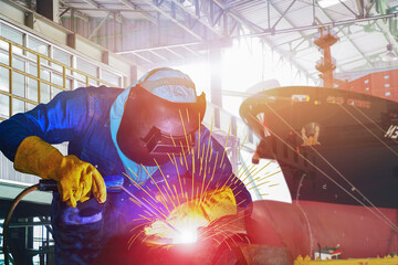 Workers Welding arc with spark weld factory at shipbuilding and ship Repairing industrials, wear...