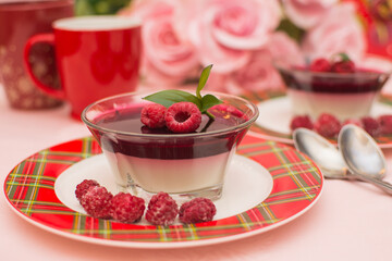 Italian dessert panna cotta with berry sauce, fresh berries.