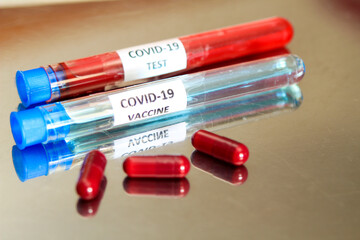 Test tubes with blood and Covid-19 vaccine