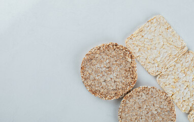 Two types of crispbread on white background