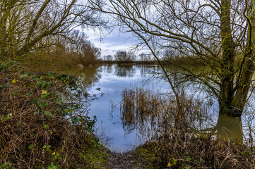 A view out across the waters of Summer Leys nature reserve near Wellingborough UK in winter