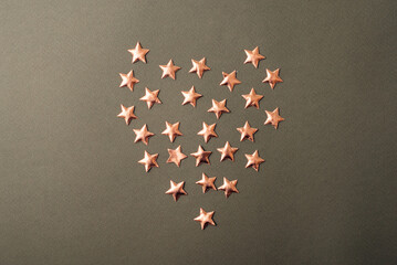 A photo of some little stars shaped in a heart .