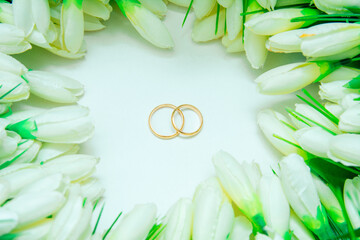 white tulips, wedding rings