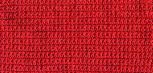 texture of crocheted red canvas with a simple pattern