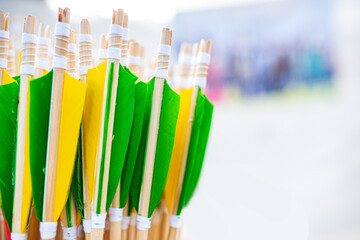 Handmade yellow green arrows with white thread