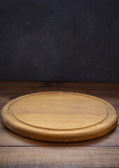 pizza cutting board at wooden table