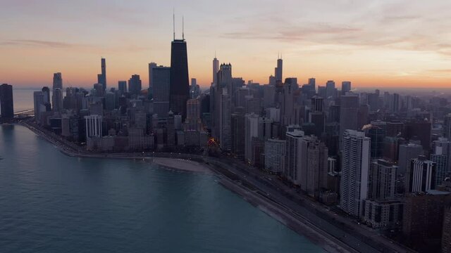 Aerial high angle view of Chicago city skyline skyscrapers and sunset sky