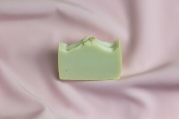 Handmade Castilian soap on a pink background.