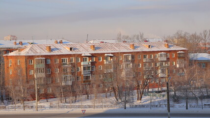 House with renovated roof. Winter city landscape.