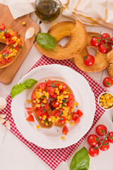 Friselle with tomatoes and mais.
