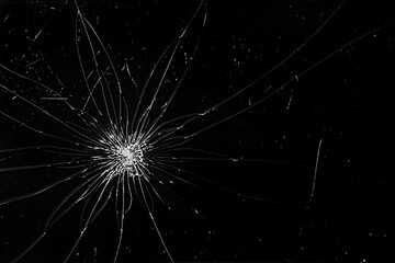 Obraz premium Broken screen cracks. Broken smartphone screen. Cracks spread across the black glass. Cracked screen.