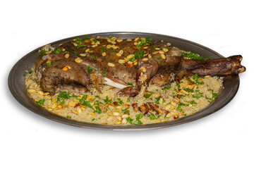 Arabic ouzi (stuffed lamb with rice). A kind of traditional Arabian food. decorated with almonds, nuts, and parsley.