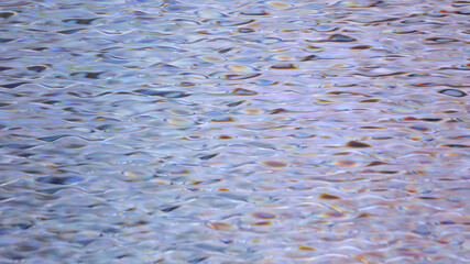 Abstract Holographic foil wave background. Rainbow metal background. Foil texture