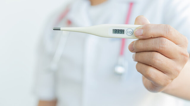 Handheld Digital Thermometer, Body Thermometer And Self Health Check And Medical Concept