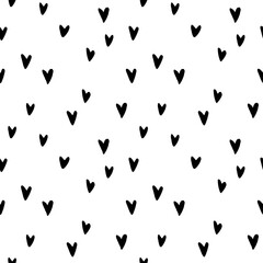 Seamless abstract pattern of small black hearts. Hand drawn doodle background, texture for textile, wrapping paper, Valentines day