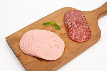 Slices salami and ham and various sausage