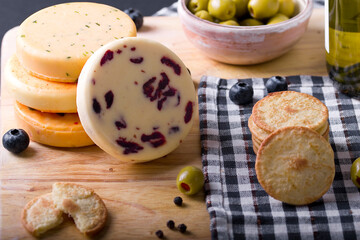 yellow cheese on a snack cracker
