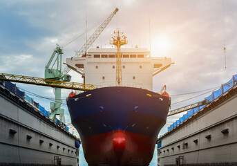 Shipyard, Ship Repair in floating dry dock under maintenance sandblasting and plainting on big...