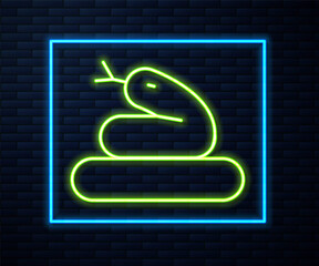 Glowing neon line Snake icon isolated on brick wall background. Vector.