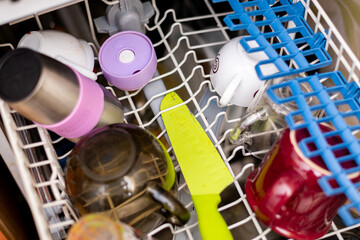Dirty dishes in the dishwasher.