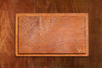 Blank nameplate for a name or title on a dark wood natural background