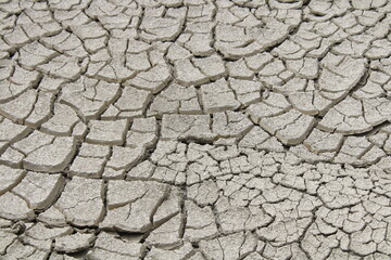 the grey texture of dried earth mud