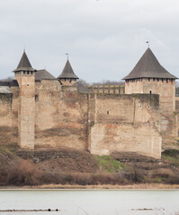 Fototapeta na wymiar View of the northern and eastern towers of the Khotin fortress from the river