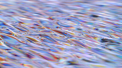 Abstract Holographic foil wave background. Rainbow metal background. Foil texture