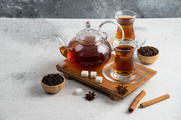 Two glasses cup of tea with sugar and star anise