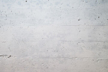 Photograph of a concrete wall in a basement painted gray