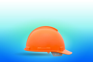 Orange hard hat safety helmet for safety concept on blue background