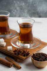 Two glasses cup of tea with sugar and star anise