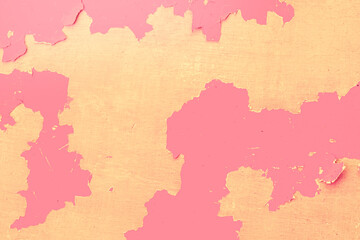 Pink peeling background.Pink wall with the peeled-off paint. It can be used as background.