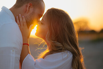 couple kissing with love at sunset, on valentine's day.