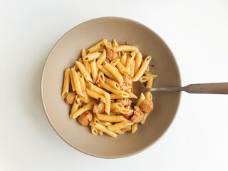 bowl of pasta with tomatoes and meat 