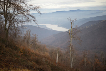 Autumn morning in the mountains, with an amazing view to the river and some mountains in the distance.
