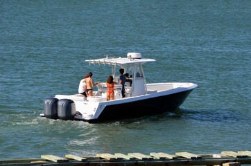 Sport fishing boat powered by two outboard engines on Biscayne Bay off of the Venetia Causeway in Miami Beach,Florida
