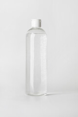 Micellar water bottle on a light background..
