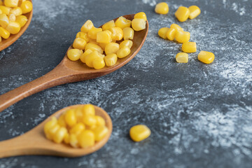 Delicious sweet corn on wooden spoons