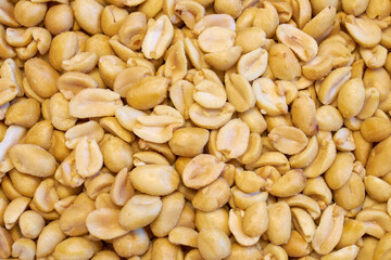 Roasted peanuts with salt as a background.