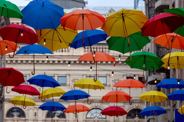 Fototapeta na wymiar Lviv. Multi-colored umbrellas over the street.